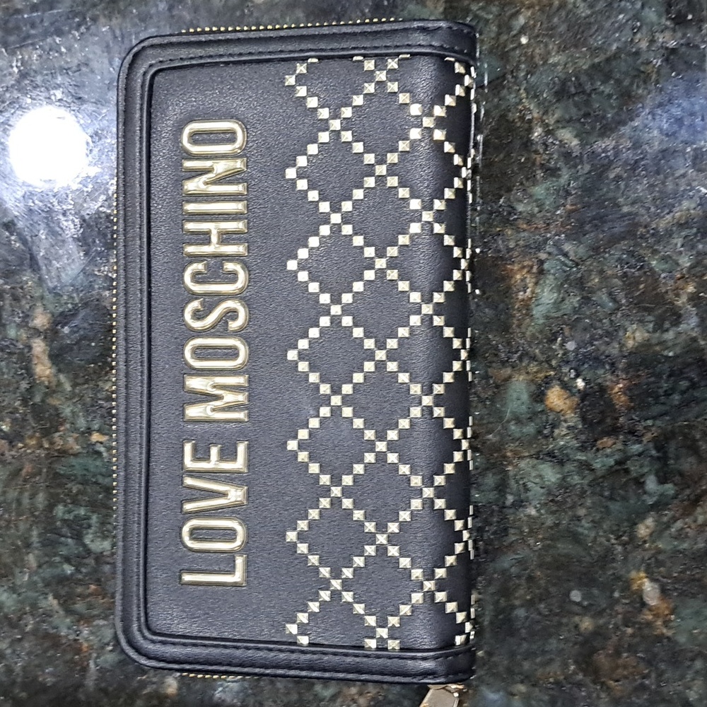 Love Moshino black and gold wallet. Authentic. Like new. Never been used.